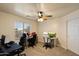 Bedroom designed for a workspace with a ceiling fan and window at 3658 E Pony Track Ln, San Tan Valley, AZ 85140