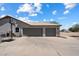 Spacious three car garage with basketball hoop and concrete driveway at 3658 E Pony Track Ln, San Tan Valley, AZ 85140