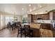 Spacious eat-in kitchen with a large island, granite countertops, and lots of natural light at 3658 E Pony Track Ln, San Tan Valley, AZ 85140