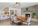 Elegant dining room with a wooden table, stylish chairs, and an open view to the kitchen at 4215 E Flower St, Phoenix, AZ 85018