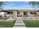 Beautiful home exterior with a cozy seating area and landscaped front yard at 4215 E Flower St, Phoenix, AZ 85018