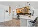 Modern kitchen with stainless steel appliances, a large island, and stylish pendant lighting at 4215 E Flower St, Phoenix, AZ 85018