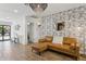 Cozy living room with patterned wallpaper, leather sofa, and modern decor at 4215 E Flower St, Phoenix, AZ 85018