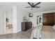 Comfortable main bedroom with a dresser and TV with a view into the main closet at 4215 E Flower St, Phoenix, AZ 85018