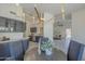 Dining area with kitchen view features an eye-catching chandelier and seating at 4248 E Jason Dr, Phoenix, AZ 85050