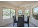 Dining room featuring large windows and a chandelier at 4248 E Jason Dr, Phoenix, AZ 85050