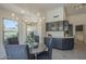 Elegant dining room with a chandelier and views from the windows at 4248 E Jason Dr, Phoenix, AZ 85050