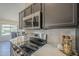 Modern kitchen with stainless steel appliances, quartz countertops, and marble backsplash at 4248 E Jason Dr, Phoenix, AZ 85050