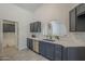 Kitchenette featuring modern appliances, marbled countertops and backsplash at 4248 E Jason Dr, Phoenix, AZ 85050