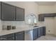 Close-up of kitchenette featuring marbled countertops, modern appliances at 4248 E Jason Dr, Phoenix, AZ 85050