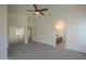 Spacious main bedroom showing access to the closet, bathroom, and hallway at 4248 E Jason Dr, Phoenix, AZ 85050