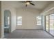 Spacious carpeted main bedroom featuring vaulted ceiling and backyard access at 4248 E Jason Dr, Phoenix, AZ 85050