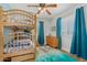 Cozy room with a wooden bunk bed, dresser, and blue accents creating a playful space at 4285 E Rousay Dr, San Tan Valley, AZ 85140