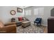Cozy living area featuring comfortable seating, a colorful rug, and natural light at 4285 E Rousay Dr, San Tan Valley, AZ 85140