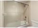 Bathroom showcasing tiled shower with glass doors, standard height toilet, and neutral walls at 4313 N 29Th Way, Phoenix, AZ 85016