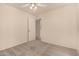 This bedroom has neutral carpet and an open door to another room at 4313 N 29Th Way, Phoenix, AZ 85016