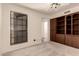 Bedroom includes neutral carpet, built-in shelves, a ceiling fan, and a window at 4313 N 29Th Way, Phoenix, AZ 85016