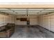 Spacious garage with shelving, water heater, and a comfortable chair at 4313 N 29Th Way, Phoenix, AZ 85016