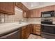 This kitchen features stainless-steel appliances, white countertops, and light wood cabinetry at 4313 N 29Th Way, Phoenix, AZ 85016
