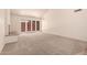 Bright living room featuring vaulted ceilings, a white-brick fireplace and French patio doors at 4313 N 29Th Way, Phoenix, AZ 85016