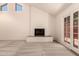 Bright living room featuring vaulted ceilings, a white-brick fireplace and French patio doors at 4313 N 29Th Way, Phoenix, AZ 85016