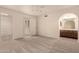 This large bedroom offers a ceiling fan, closet, and an en-suite bathroom with double sink at 4313 N 29Th Way, Phoenix, AZ 85016