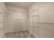 Walk-in closet with neutral carpet and lots of wire shelving for ample storage at 4313 N 29Th Way, Phoenix, AZ 85016