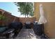 Backyard area featuring a grill, landscaping, and a small patio at 451 S Hawes Rd # 53, Mesa, AZ 85208
