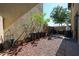 Backyard features desert landscaping, a small patio, and a grill, perfect for outdoor entertaining at 451 S Hawes Rd # 53, Mesa, AZ 85208