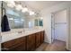 Bright bathroom with a large mirror, double sinks, dark wood cabinets, and a separate shower at 451 S Hawes Rd # 53, Mesa, AZ 85208