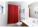 Bathroom featuring a shower with red curtain, vanity with storage, and a matching medicine cabinet at 451 S Hawes Rd # 53, Mesa, AZ 85208