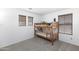 A bedroom showcasing a wood bunk bed with multiple windows, providing lots of sunlight at 451 S Hawes Rd # 53, Mesa, AZ 85208