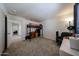 Spacious carpeted bedroom featuring a loft bed, desk, and ample natural light at 451 S Hawes Rd # 53, Mesa, AZ 85208