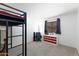 A bedroom featuring a stylish black metal bunk bed frame and neutral-toned walls, perfect for a modern touch at 451 S Hawes Rd # 53, Mesa, AZ 85208