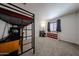 Comfortable bedroom features a loft bed, a desk and a dresser with modern décor at 451 S Hawes Rd # 53, Mesa, AZ 85208