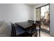 Cozy dining area with a wooden table, comfortable chairs, and sliding glass doors to the backyard at 451 S Hawes Rd # 53, Mesa, AZ 85208