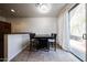 Cozy dining area with table, chairs, and natural light from sliding glass door at 451 S Hawes Rd # 53, Mesa, AZ 85208