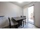Bright dining area featuring neutral walls, tile floors, and sliding glass doors at 451 S Hawes Rd # 53, Mesa, AZ 85208