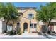 Charming two-story home featuring a welcoming front porch and well-maintained landscaping with mature trees at 451 S Hawes Rd # 53, Mesa, AZ 85208