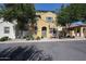 Charming two-story home with an inviting entryway and mature trees shading the front at 451 S Hawes Rd # 53, Mesa, AZ 85208