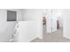 Bright hallway with a staircase leading to a bedroom and a doorway, creating a sense of spaciousness at 451 S Hawes Rd # 53, Mesa, AZ 85208