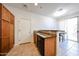 Modern kitchen area leading to a dining space with lots of natural light at 451 S Hawes Rd # 53, Mesa, AZ 85208
