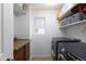 Organized laundry room with shelves and updated washer and dryer at 451 S Hawes Rd # 53, Mesa, AZ 85208