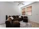 Inviting living room with a comfortable brown sofa and neutral-toned decor at 451 S Hawes Rd # 53, Mesa, AZ 85208