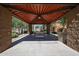 View of the covered picnic area with table and seating overlooking community pool at 451 S Hawes Rd # 53, Mesa, AZ 85208