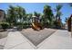 Community playground area showcasing play structures, walking paths and landscaped surroundings at 451 S Hawes Rd # 53, Mesa, AZ 85208