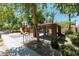 Community playground with a picnic shelter, bbq, slides, and play structure at 451 S Hawes Rd # 53, Mesa, AZ 85208