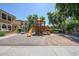 Exterior shot of the community playground with slides, climbers, and shade trees at 451 S Hawes Rd # 53, Mesa, AZ 85208