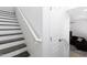 Staircase leading to living space with dark wood and white trim at 451 S Hawes Rd # 53, Mesa, AZ 85208