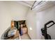 Angle view of carpeted storage area under the stairs with boxes and miscellaneous items at 451 S Hawes Rd # 53, Mesa, AZ 85208